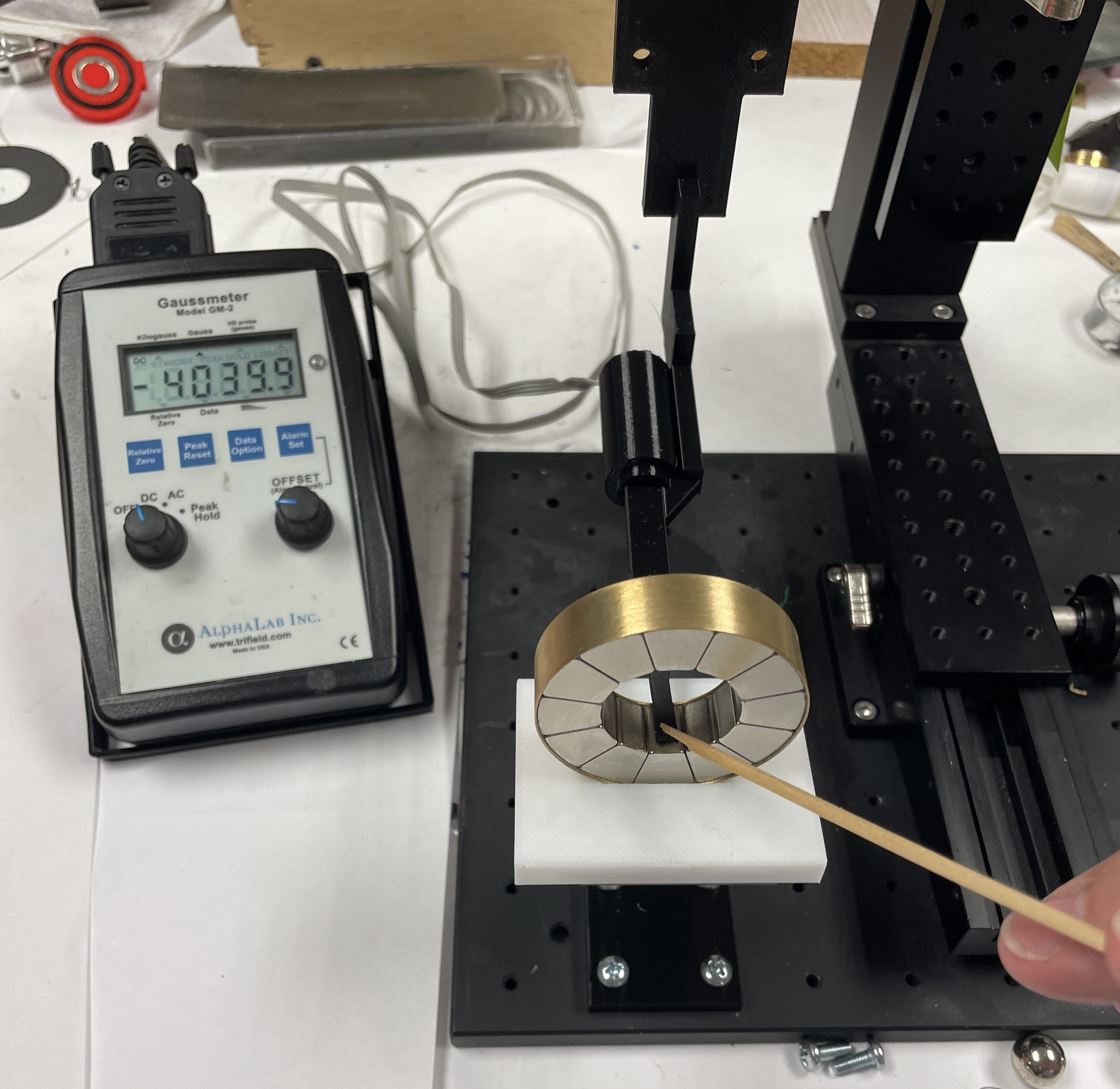 Gauss meter measuring permanent magnet radial ring.
